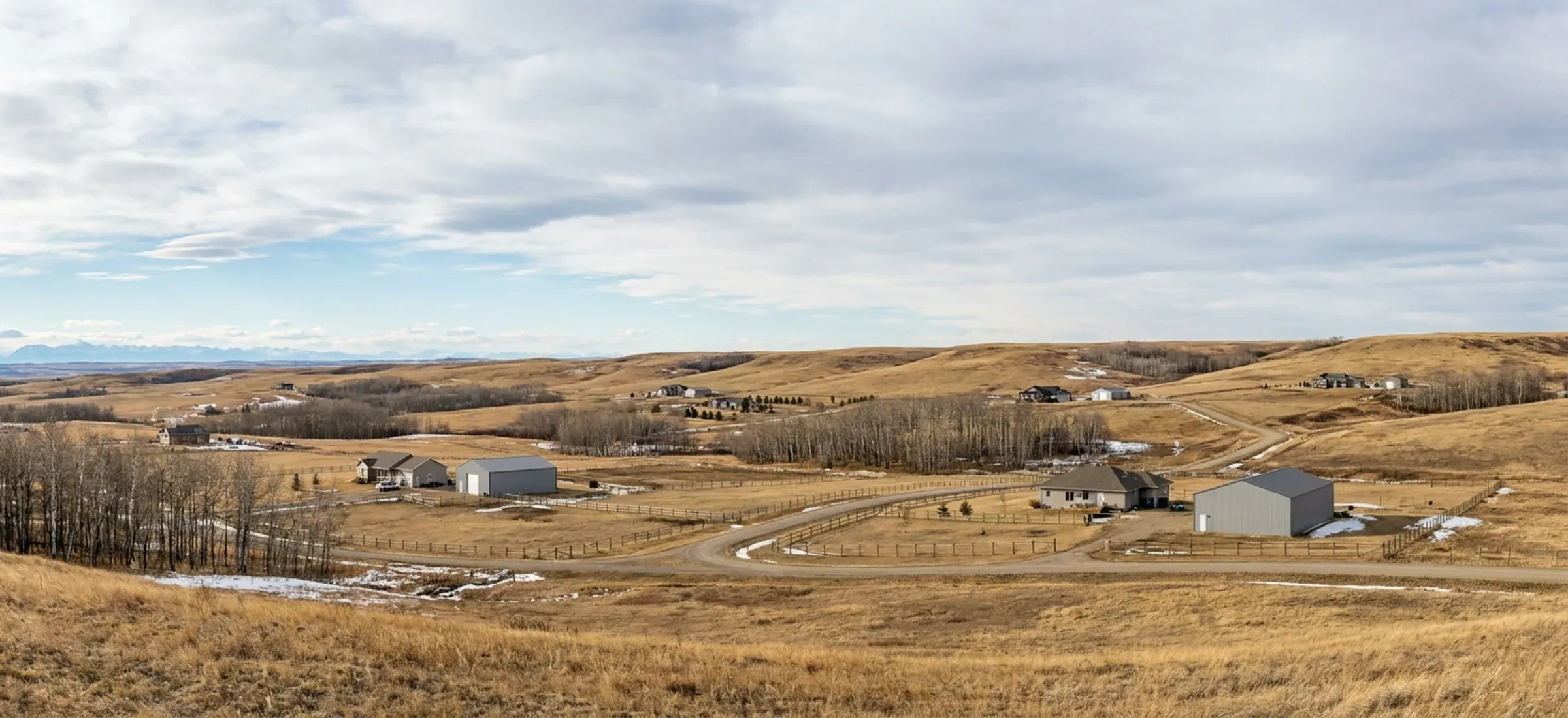 Rolling country-residential acreages with steel shops and aspen bluffs, mountains on the horizon